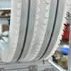 The Bottle Gripper Elevator (also Known As Clamp-Type Bottle Elevator Or Bottle Clamp Conveyor)